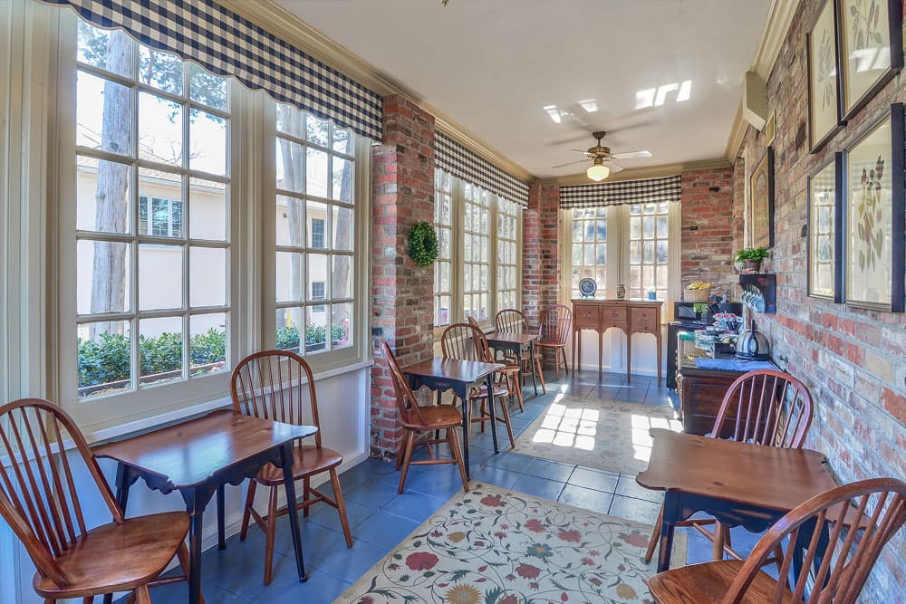 tables and chairs in a room for dining