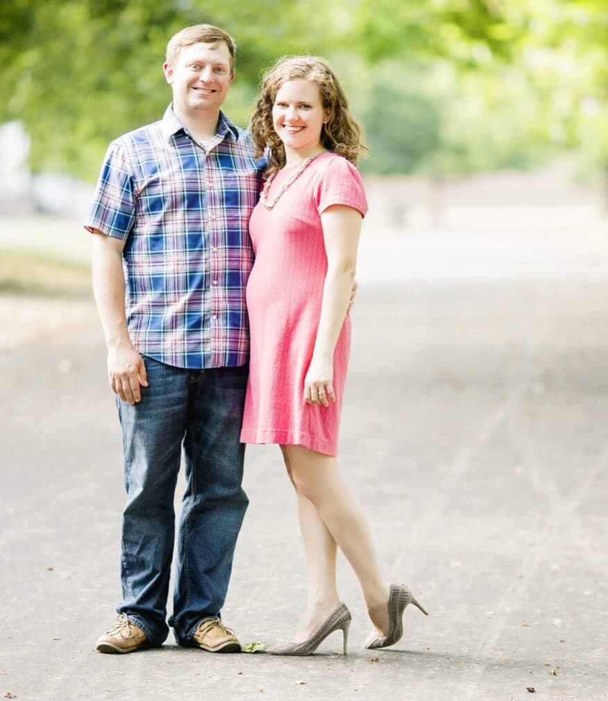 Photo of Innkeeper Alex in a blue checkered shirt and Innkeeper Laura in a pink dress with cream heels